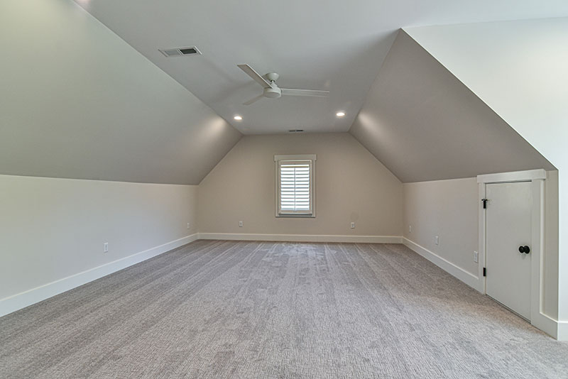 Bonus room with sloped ceilings, a dormer window and neutral carpet