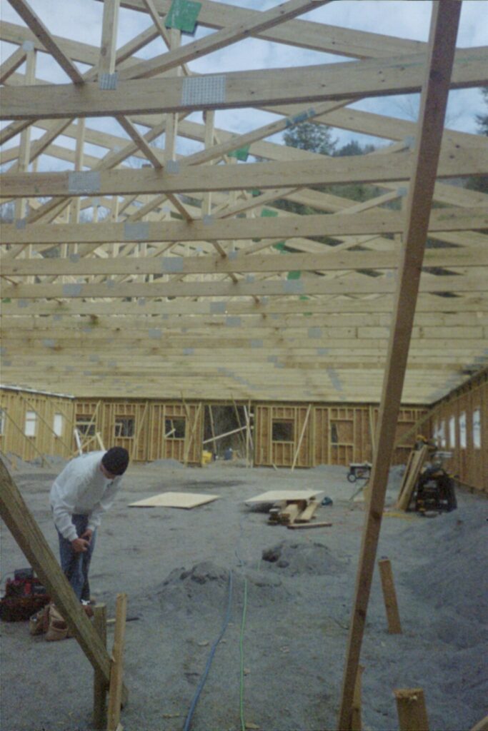 Crew putting up roof trusses at the riding arena in Fairview, NC