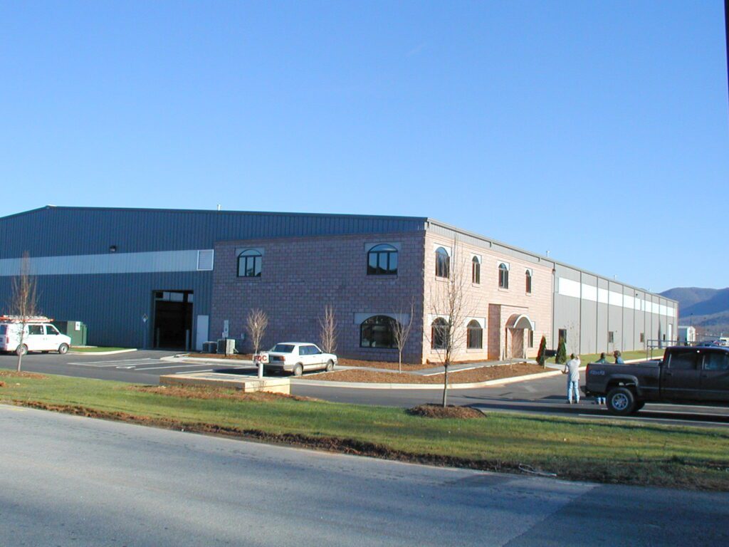 Resinart in Fletcher, NC — commercial building with a brick and arched-window office front