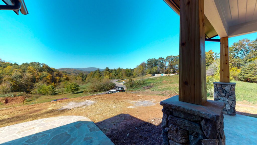 View from the covered porch across open pasture to the Blue Ridge mountains