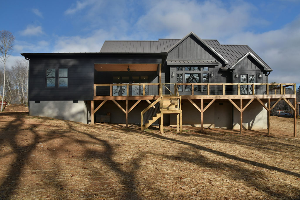 Rear elevation with a covered deck on timber posts overlooking the yard