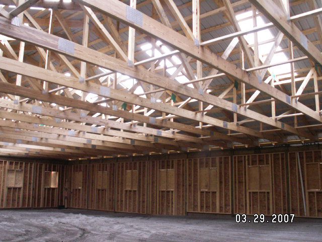 Interior framing and roof trusses of the riding arena in Fairview, NC