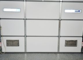 Insulated garage door fitted with flood vents