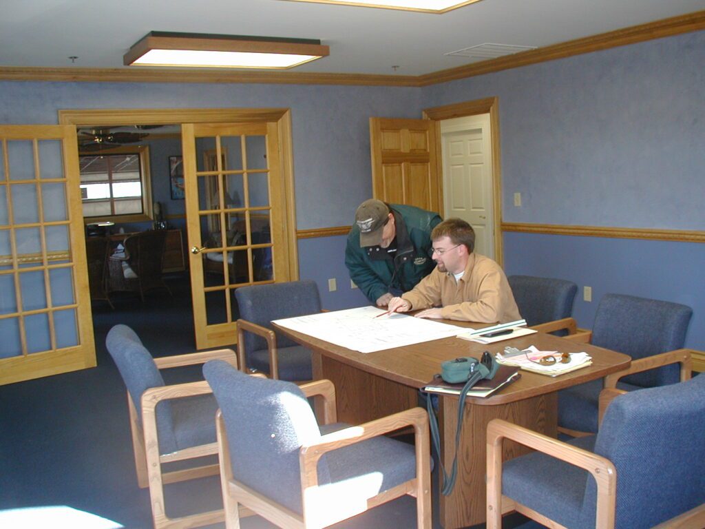 Conference room with french doors and a meeting table at Resinart